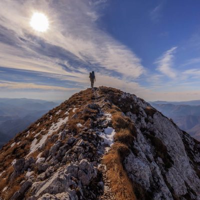 Employee on top of mountain